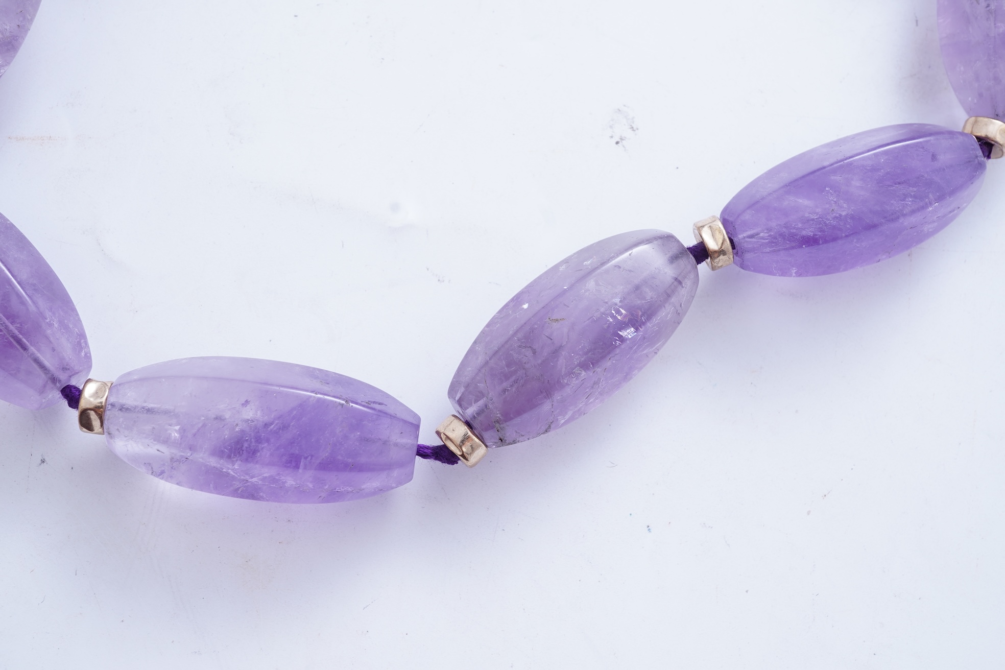 An amethyst and gold necklace